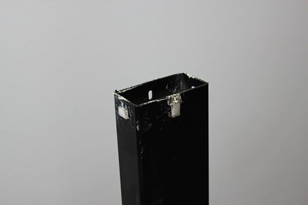 VertDesk v3 glides on inner column that slide against raw steel