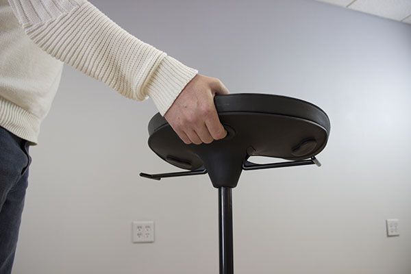 Carry handle under seat pad
