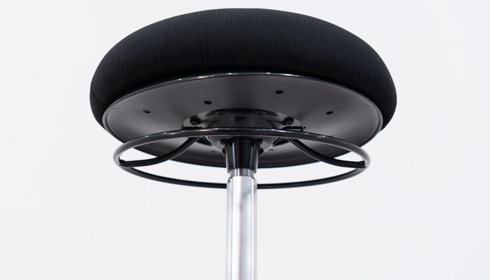Cylinder attached to underside of seat