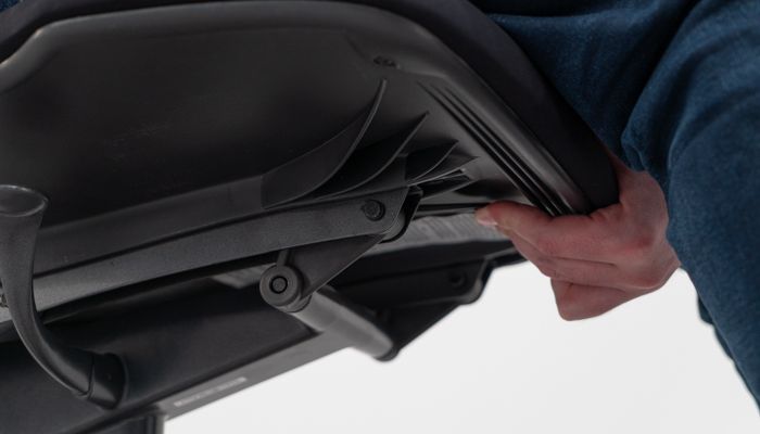 Lever under front of seat pan for seat depth adjustment