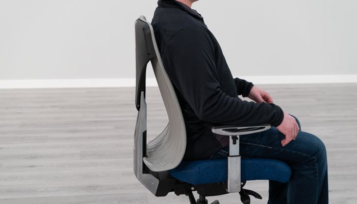 Seated in Truly chair to show lumbar curve