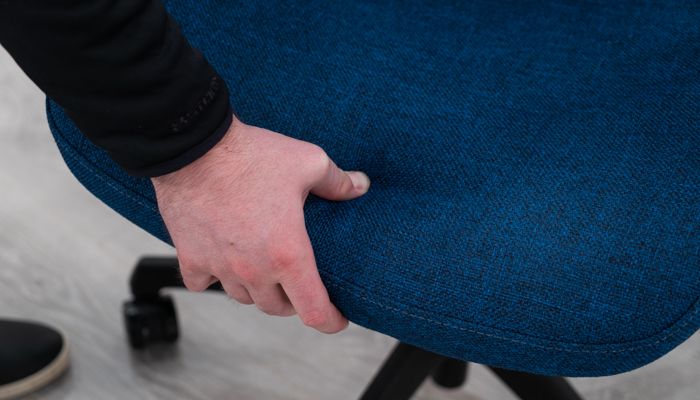 Pushing down on seat pad