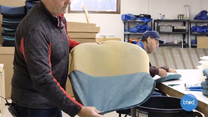 Pulling upholstery from seat pad