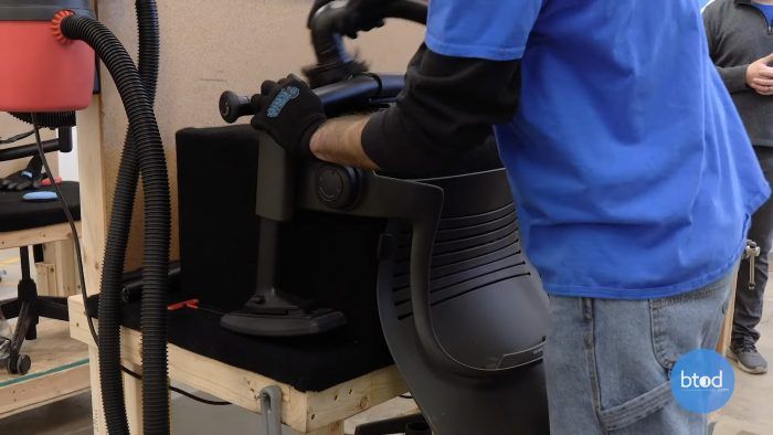 Using dirty vacuum to clean bottom of frame