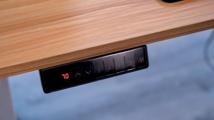 Programmable buttons on electric standing desks