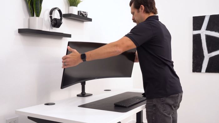Showing the monitor arm letting the computer screen tilt downward